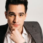 Brendon Urie takes off his clothes during concert