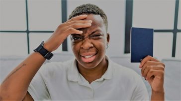 transgender person gender nonconforming human confused holding passport government identification